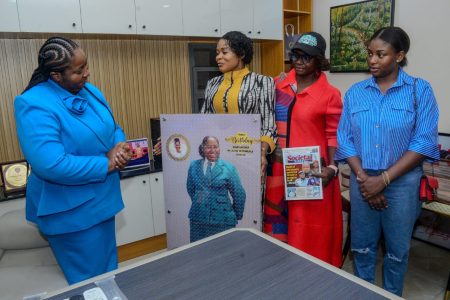 Amb. Oluwayomi Oluwapelumi with her team during the courtesy visit of Societal Concern - Oluwayomi Societal Youth Concerns Initiative Managing Director, Executive Trainers Ltd, Dr. Mrs. Ajoke Ogunsan being presented the large Portrait from the Publisher, Societal Concerns Magazine, Amb. Oluwayomi Oluwapelumi with her team during the courtesy visit of Societal Concerns Team to Dr. Mrs. Ogunsan…