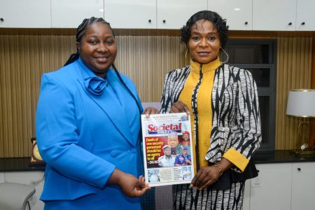 Managing Director, Executive Trainers Ltd, Dr. Mrs. Ajoke Ogunsan being presented copy of the Societal Concerns Magazine from the Publisher, Societal Concerns Magazine, - Oluwayomi Societal Youth Concerns Initiative